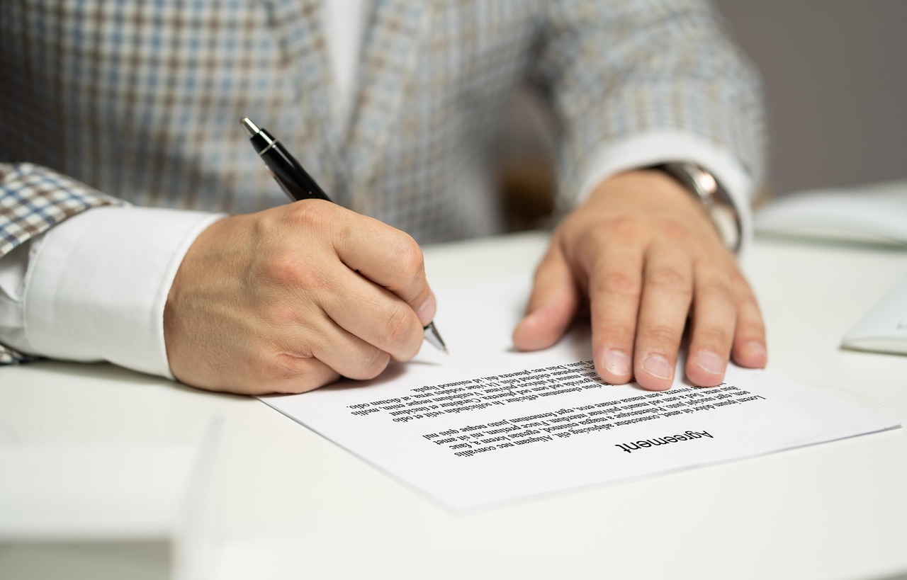 Signing a legal contract for debt collection